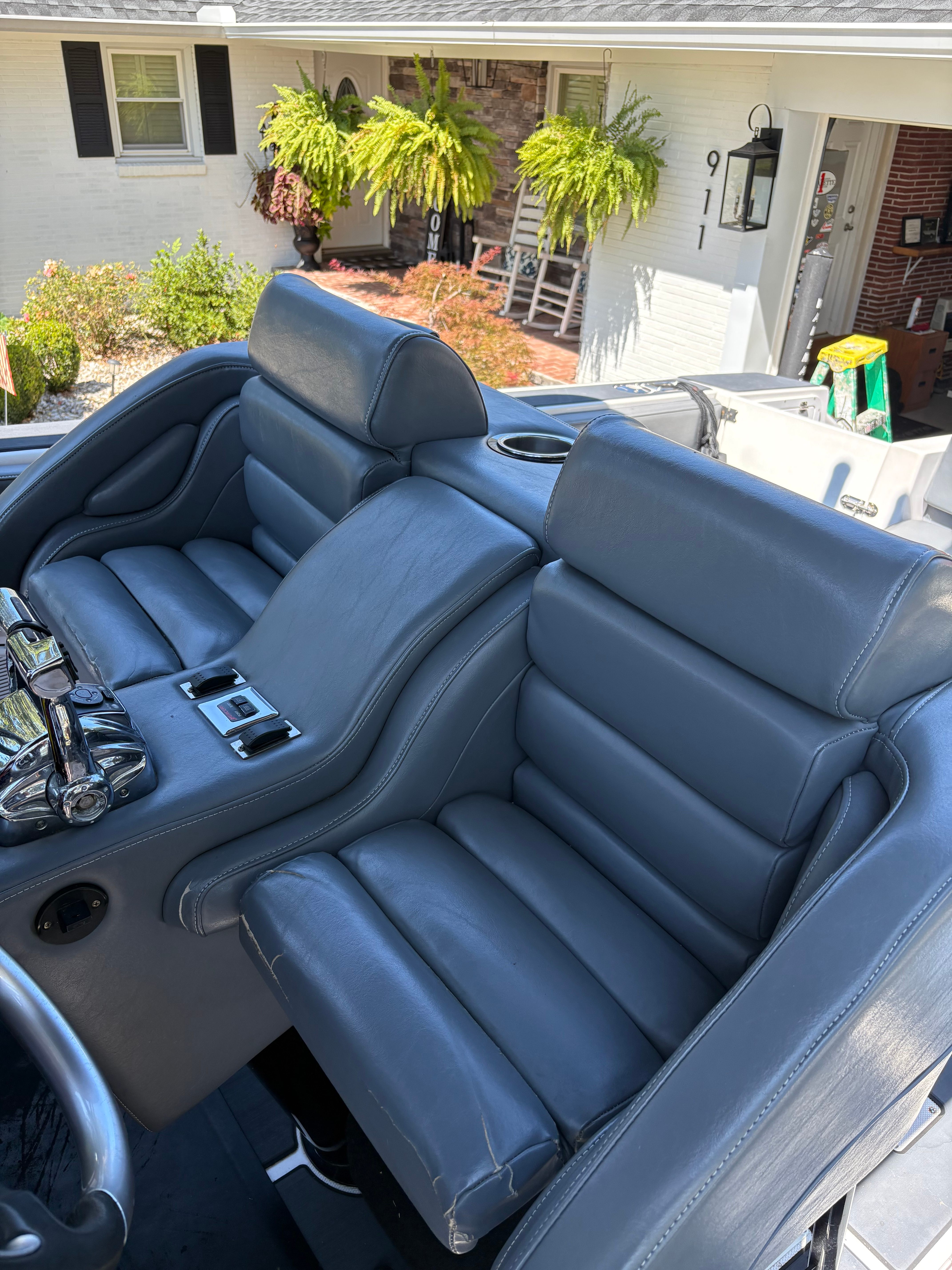 Premium gray leather bolster helm seats with chrome throttle controls