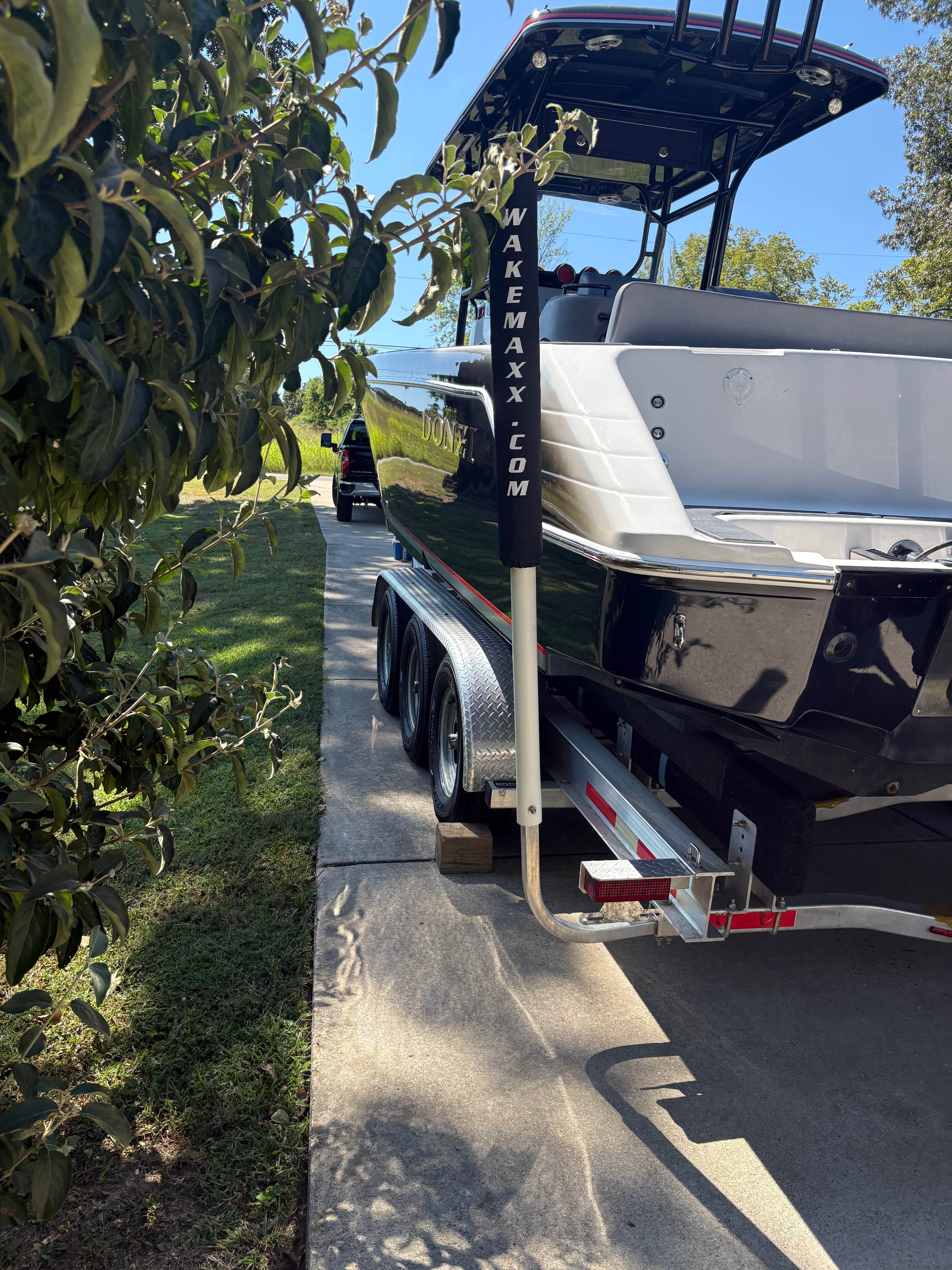 Donzi 35 ZX port stern on triple-axle trailer with Wakemaxx guides